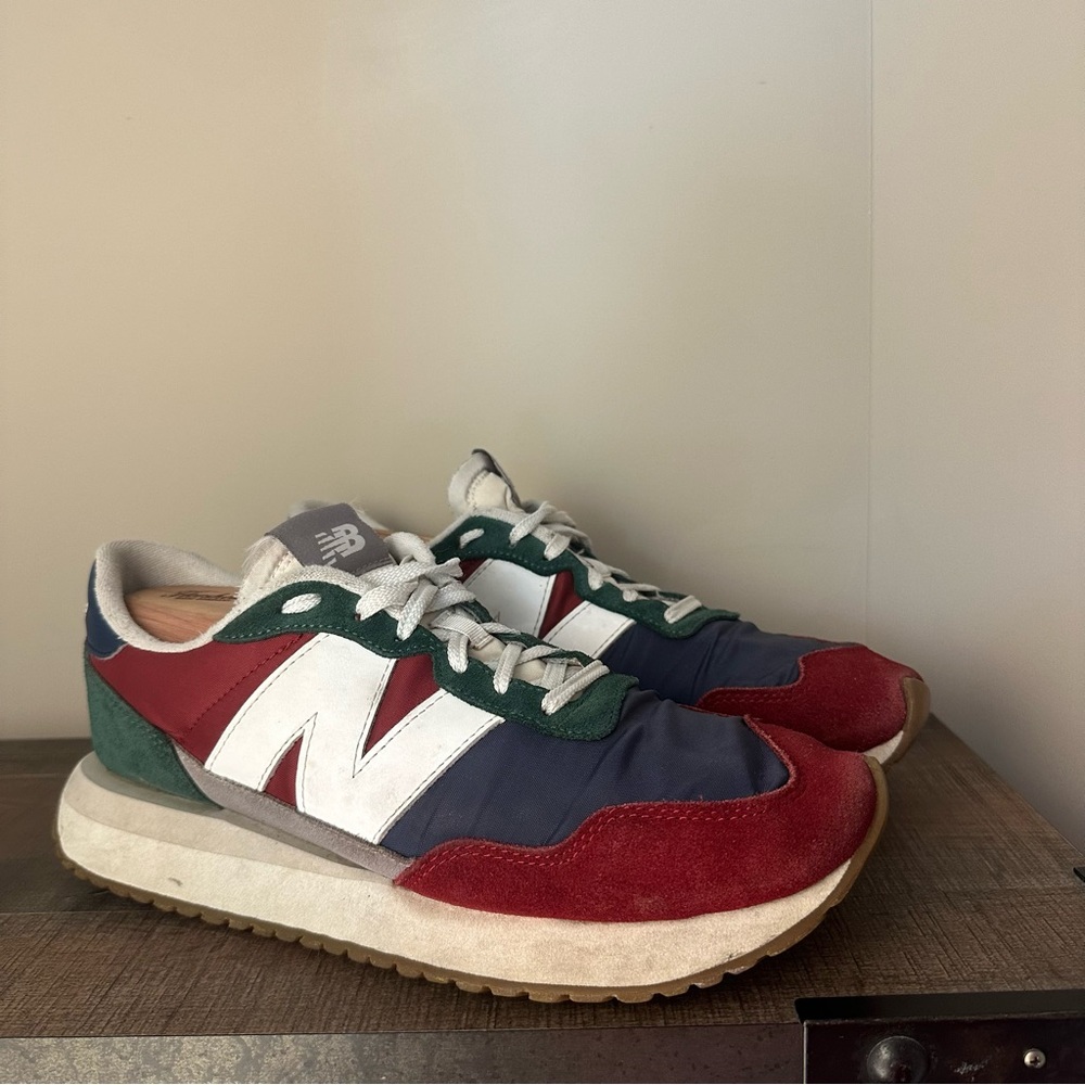 New Balance Men’s Size 10 Shoes in Red, White, Blue, and Green.
